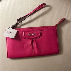 NWT Coach Fuchsia leather wristlet.